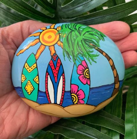 Can you tell I’m ready for summer? 🏄‍♀️🌊☀️🏝👙🩴🐚 *SOLD* #surflife #beachlife #summervibes #beachdecor #summertimefun #rockpaintingartist… | Instagram Coastal Rock Painting Ideas, Beach Rock Art, Happy Stone, Surfboard Painting, Beach Art Painting, Garden Rock Art, Diy Rock Art, Painted Rock Animals, Stone Art Painting