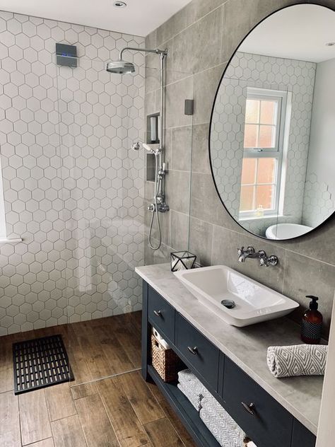 -MEDIUM a moody bathroom with grey tiles, a black vanity, white hex tiles in the shower space looks wow Wood Tile Shower, Wood Effect Floor Tiles, Wet Room Bathroom, Bathroom Cladding, Wood Floor Bathroom, Grey Bathroom Tiles, Wet Room, Upstairs Bathrooms, Bathroom Floor Tiles