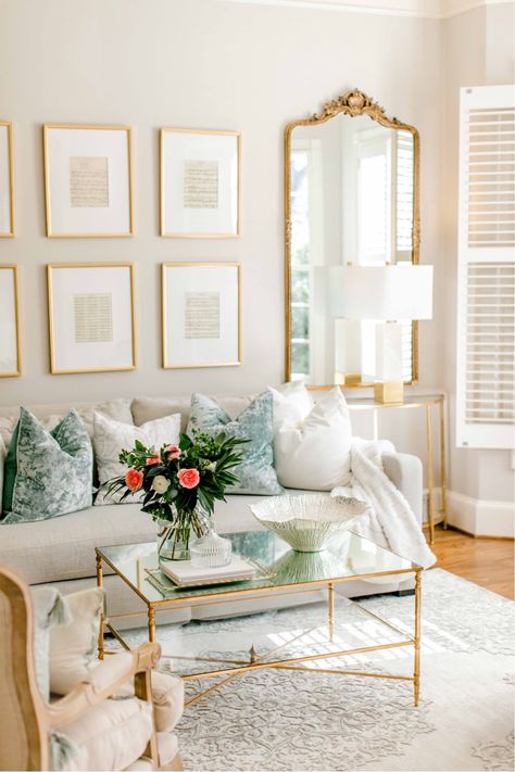 Living Room With Gold Coffee Table, White Marble Coffee Table Decor, French Mirror Living Room, Lamp On Books, Antique White Living Room Walls, Gold Mirror Living Room Decor, Gold Coffee Table Decor, Gold Mirror Living Room, Marble Lamps