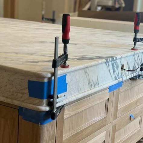 @lisastatondesign on Instagram: "Side visit repost of our project with @rippledesignstudio. The kitchen island is coming in 🔥with custom oak cabinets (and a fancy leg detail executed by our local friends at Price and Visser) and the doubled up marble top detail.  Ready for finishing!" Kitchen Islands With Legs, Double Kitchen Island, Kitchen Island With Legs, Wall Trim Molding, Kitchen Island Furniture, Kitchen Showrooms, Double Island Kitchen, Custom Kitchen Island, Kitchen Showroom