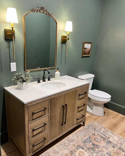 Ashlee OlsonㅣThe Olson Place on Instagram: "Wow, 2 posts in one week. It’s a miracle. This is a room that I don’t think I’ve ever shared that I absolutely love in our home. The powder bathroom. I took a risk (for me) and went moody. The color is Sherwin Williams Pewter Green, which I also used in our theater room. It is darker in real life, especially because there are no windows in there. • • • • • • • • #housesofinstagram #homesofinstagram #homesofig #building #customhome #customhomes #blackwi Waterloo Sherwin Williams Bathroom, Riverway Sherwin Williams Bathroom, Sherwin Williams Pewter Green Bathroom, Pewter Green Sherwin Williams Bathroom, Moody Bathroom No Window, Bathroom No Windows Paint Color, Moody Bathroom Colors, Green Moody Bathroom, Bathroom No Windows