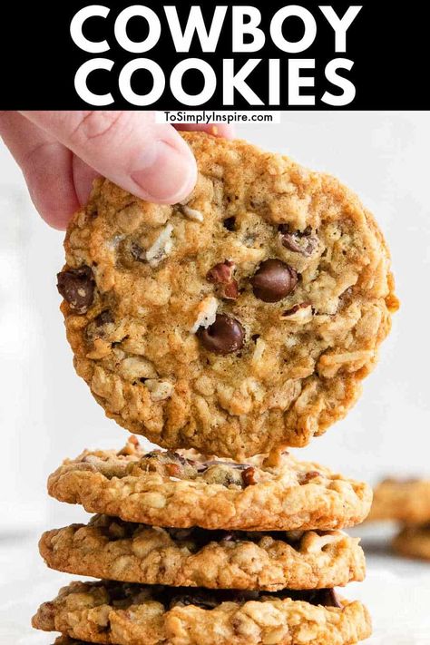 Cowboy Cookies, aka Ranger Cookies, are a hearty yet soft and chewy oatmeal cookies with some nutty crunch, ooey-gooey chocolate chips, flakes of coconut, and fully loaded with flavor! Cookies Cowboy, Soft And Chewy Oatmeal Cookies, Cowboy Cookie, Ranger Cookies, Cowboy Cookie Recipe, Chewy Oatmeal Cookies, Coconut Oatmeal, Cowboy Cookies, Oatmeal Cookies Chewy