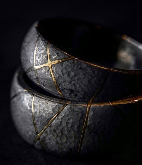 Kintsugi Iron & Gold Wedding Rings | Kintsugi (also known as Kintsukuroi) is the Japanese art of repairing broken pottery with gold or silver, with the understanding that the piece is not damaged, but is – in fact – more beautiful for having been broken. Which makes this wedding band set a gorgeous symbol of broken hearts who have found each other and healed together. #WeddingRings #UniqueWeddingRings Men’s Band Rings, Unique Wedding Band Sets, Rings For Man, Jewellery Photo, Cool Rings For Men, Unique Mens Rings, Iron Jewelry, Iron Ring, Mens Gold Bracelets