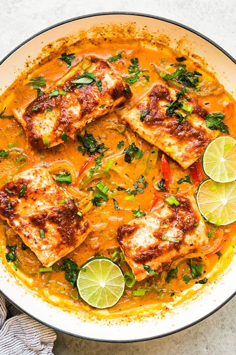 Thai-inspired Red Curry Salmon is simmered in an incredibly tasty coconut red curry sauce with bell peppers, garlic and onions. #curry #coconut #salmon #fish #healthydinner #healthyrecipes #dinner Salmon Red Curry, Red Curry Salmon, Coconut Salmon, Coconut Red Curry, Curry Salmon, Curry Coconut, Red Curry Sauce, Vegan Paleo Recipes, Lunch Appetizers