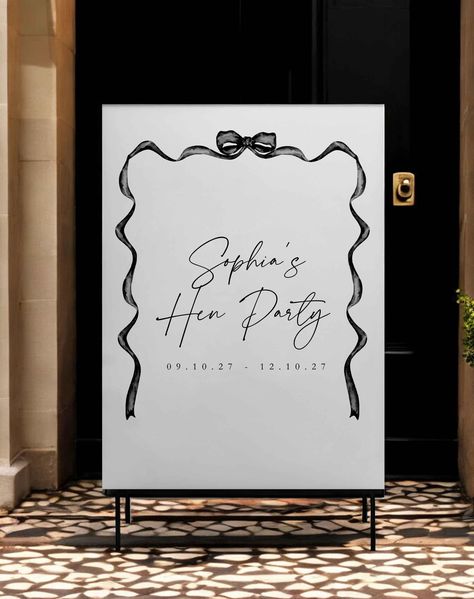 Make a lasting impression on your guests with the Sophia's Bow Hen Party Sign. This stylish and personalised sign features a beautiful bow design and customisable text, perfect for welcoming your friends and family to your hen party. Key Features: Ribbon design Modern and stylish layout Customisable text (name, dates) High-quality materials Create a memorable and welcoming atmosphere for your hen party with this personalized sign. Order yours today! FAQS What size are the signs? The size of the Gold Wedding Stationery, Telephone Design, Event Signage, Party Sign, Minimal Decor, Ribbon Design, Bow Design, Online Printing Services, Party Signs