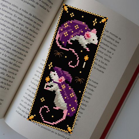 Cross stitch pattern for a Halloween bookmark featuring cute mice and a witchy design. This funny and dark cross stitch combines autumn aesthetics with a touch of Halloween charm. Perfect for book lovers, this happy Halloween bookmark embroidery adds a whimsical and spooky touch to your reading. This cross stitch pattern includes multiple downloadable PDF files for immediate access, such as: - Color-coded pattern with a floss legend (ideal for printing) - Monochrome pattern with a floss legend ( Books Cross Stitch Pattern, Cross Stitch Patterns Bookmarks, Cross Stitch Bookmark Patterns, Book Cross Stitch, Embroidery Bookmark, Cross Stitch Ornaments, Aesthetic Bookmark, Bookmark Cross Stitch, Spooky Diy