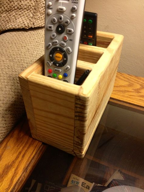 Remote control holder Remote Stand, Tv Remote Holder, Dvd Organization, Remote Organization, Remote Caddy, Remote Control Organizer, Diy Popsicle Stick Crafts, Diy Apple, Wooden Desk Organizer