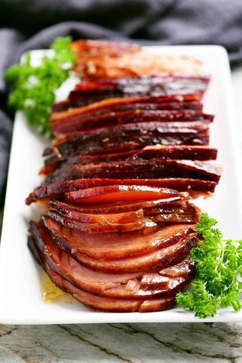 This Hot Honey Baked Ham recipe has a mouthwatering combo of sweet and spicy that's perfect for a holiday dinner or hot honey ham sandwiches! Hot Honey Ham Glaze, Honey Ham Sandwiches, Baked Ham Recipe, Spicy Ham, Honey Baked Ham Recipe, Ham Sauce, Hot Honey Recipe, Ham Recipes Baked, Gunny Sack