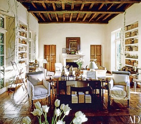 In a June 1991 article on her home in Southern California, Rose Tarlow said, “I was trying to prove to myself that you can create an ageless house.” Decades later, the living room stands the test of time, with its signature design elements, including ceiling crossbeams from an 11th-century English church, 18th-century French doors, and floors of 17th-century oak. Rose Tarlow Interiors, Living Room Stands, Rose Tarlow, French Doors Interior, White Rooms, French House, Architectural Digest, Beautiful Interiors, Living Room Inspiration