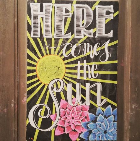 My "Here Comes the Sun" chalkboard--- #summer #sunshine #chalkboardart Sunshine Chalkboard Art, Here Comes The Sun Chalkboard Art, Sun Chalkboard Art, Summer Whiteboard Art, Chalkboard Art Summer, Summer Blackboard Ideas, Summer Chalkboard Art Ideas, Summertime Chalkboard Ideas, May Chalkboard Art