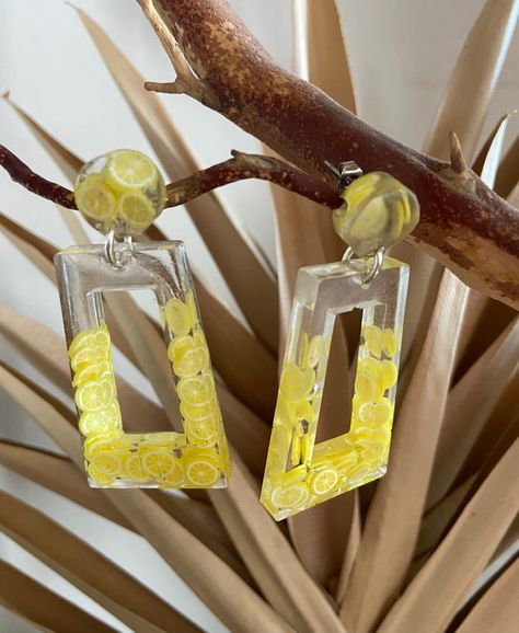 "100% handmade resin dangle earrings. These are made with polymer clay lemons and epoxy resin. Silver colored jump rings attach the pieces together, and the posts are made from hypoallergenic stainless steel. Light enough for every day wear! Earrings measure: 2.25\" long, 1\" wide" Steel Light, Resin Earrings, Jump Rings, Epoxy Resin, Jewelry Earrings Dangle, Etsy Earrings, Dangle Drop Earrings, Polymer Clay, Dangle Earrings