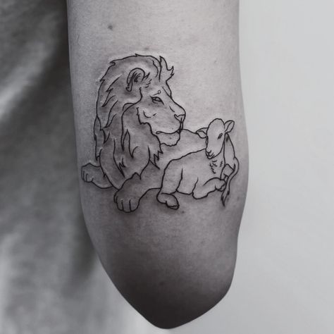 A meaningful piece with a beautiful message was created here at Fine Ink Studios UCF. 🦁🐑 Thank you, @emmaliizabeth, for trusting us with this special lion and lamb tattoo. It’s an honor for our artist @blissed.out.ink to bring such significant artwork to life. 💛 If you’re ready to turn your meaningful ideas into ink, DM us to book your session! 📩 #fineinkucf #lionandlambtattoo #christiantattoo #ucfknights #orlandotattooartist #finelinetattoo #ucf Daniel In The Lions Den Tattoo, Christian Lamb Tattoo, Lion And The Lamb Tattoo For Women, The Lion And The Lamb Tattoo, He Leaves The 99 Tattoo, Lion Lamb Tattoo, Lion And The Lamb Tattoo, Lamb Of God Tattoo, Feminine Lion Tattoo