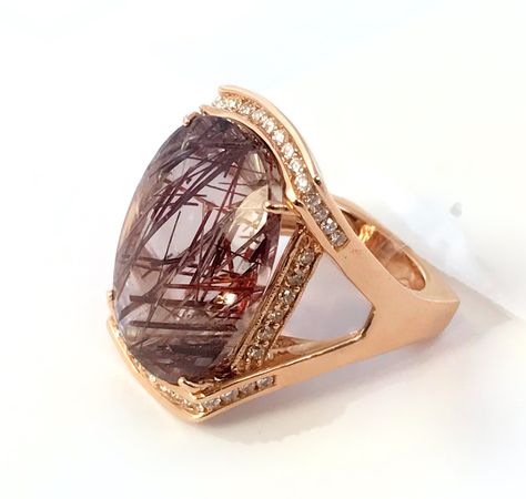 One of a kind Rutilated Quartz Ring in Rose Gold #trendsetter #fashionforward #frd #frankreubeldesigns #jewelry design #jewelry-designer #jewelry #love #gemstone #award-winning #designer #fashion #style #emerald #ring #aquamarine #march-birthstone #gold #diamonds #frank #reubel #newdesign #jck #jckbound #vegas #jckvegas #unique #highend #fine-jewelry #sparkle #bling #celebrity #necklace #shopping #name #brand #famous #nice #beautiful #earrings #necklace #bracelet #accessories Celebrity Necklace, Rutilated Quartz Ring, Red Stones, Jewelry Design Drawing, Tourmalinated Quartz, Bracelet Accessories, Vintage Diamond Rings, Quartz Jewelry, Purple Stones