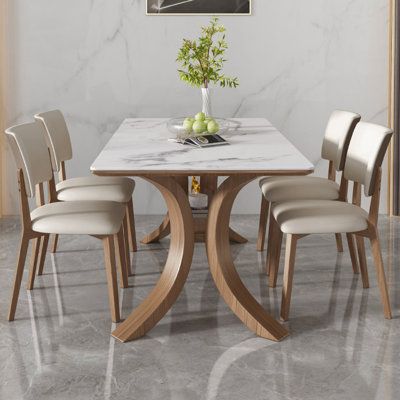 The table can be placed under the design, open shelf Size: 30.11"H x 55.11"L x 31.49"W | Orren Ellis Kaynie Rectangular Dining Set 30.11 H x 31.49 W x 55.11 D in brownWood / Upholstered in White | 30.11"H x 55.11"L x 31.49"W | Wayfair Wood And White Dining Table, Dining Table Chairs Design, Marble And Wood Dining Table, Marble Dining Table Design, Daining Table, Marble Dining Table Set, Dining Room Accent Wall, Calumet City, Marble Top Dining Table