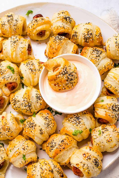 These homemade Pigs in a Blanket are the ultimate party appetizer featuring smoky sausages wrapped in pastry, sprinkled with sesame seeds, and served with a sweet and tangy dipping sauce! Smokies In A Blanket, Homemade Pigs In A Blanket, Hot Dog Appetizers, Hot Dog Crescent Rolls, Pigs In A Blanket Recipe, Chicken Hot Dog, Sausage Wrap, Mini Hot Dogs, Easy Weeknight Recipes