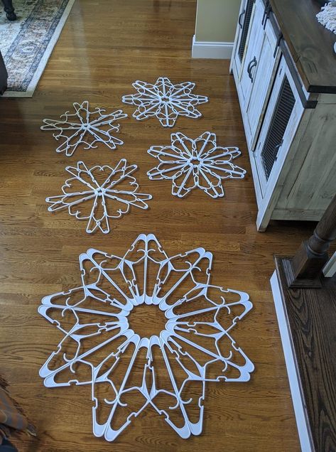 Dollar Tree Hanger Snowflake, Snowflakes From Hangers, Clothes Hangers Ideas Crafts, Snowflake Made Out Of Plastic Hangers, Plastic Clothes Hanger Snowflake, Diy Hanger Snowflake, Hanger Snowflake Diy With Lights, Clothes Hanger Snowflakes, Plastic Hanger Snowflake