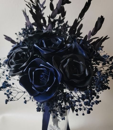 7 Beautiful leather roses. With  greenery accents. 3 black leather, 4 deep sea blue leather roses in this beautiful arrangement that lasts forever.    Stem has criss cross leather ribbon, finishes off with black leather and navy blue satin ribbons...  gorgeous bouquet  💐 Navy Blue And Black Wedding Theme, Navy Blue And Black Wedding, Black And Blue Wedding Theme, Flowers Anniversary, Gothic Wedding Theme, Dark Blue Wedding, Black Bouquet, Gorgeous Bouquet, Chincoteague Island