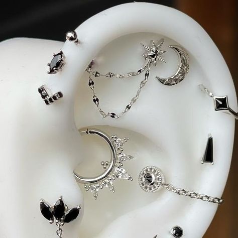 Loran Shumway on Instagram: "Black and white gold 🔥 Beautifully curated ear done by Brooke. We have only a few openings left this week and so much beautiful jewelry in stock to pick from!!! Call/Message/BookOnline: https://skindeepolean.net" Black Earring Curation, Black And Silver Earring Stack, Goth Ear Piercings, Black Ear Piercings, Black Piercings, Black And Silver Earrings, Real Silver Necklace, Pretty Piercings, Ear Curation