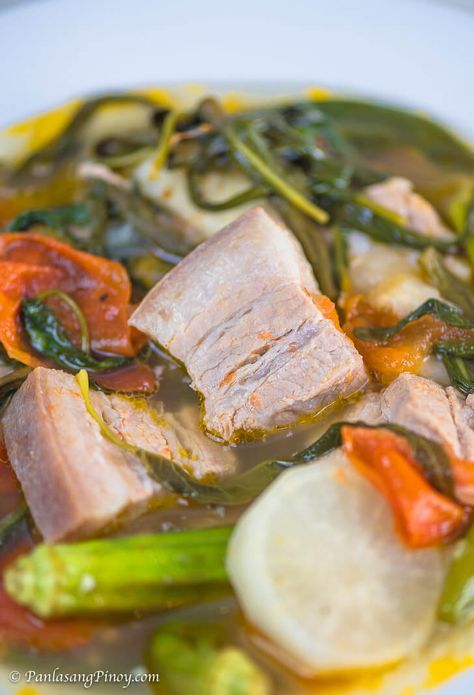 Sinigang na Baboy with Gabi is a popular Filipino soup dish. It is composed of pork and vegetables boiled in a clear sour broth. Sinigang Na Baboy Recipe, Pork Belly Soup, Filipino Soups, Poaching Chicken, Philippine Recipes, Pork Sinigang, Filipino Soup, Sinigang Recipe, Philippine Food