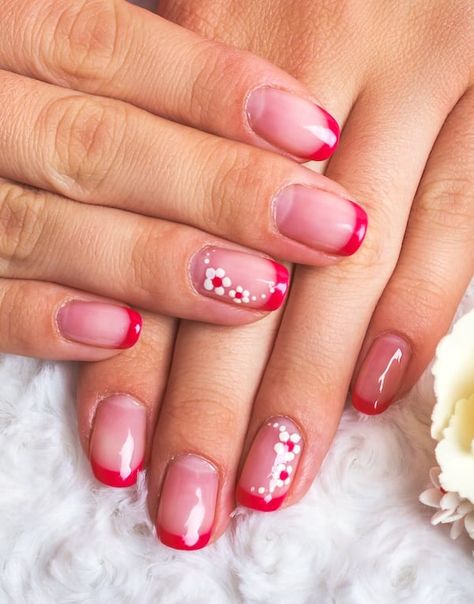 Pink/red French tip nails with floral nail art. Colored Tipped Nails, Nails With Red Tips Short, Red And Pink French Tip Nails Short, Pink Nail Red Tip, Pink Nail With Red French Tip, Pink Red Nail Art, Red Tip Gel Nails French Manicures, French Manicure Red Tips Square, Short French Tip Acrylic Nails With Design