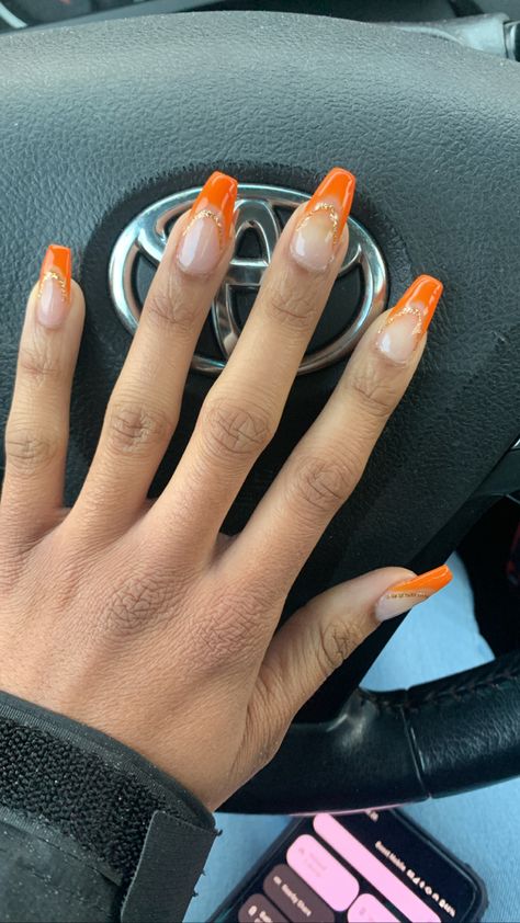 Orange And Gold French Tip Nails, Orange French Chrome Nails, Nails For Orange Prom Dress, Orange Prom Nail Ideas, Orange Hoco Nails, Orange Sparkly Nails, Orange And Gold Nail Designs, Gold And Orange Nails, Orange And Silver Nails