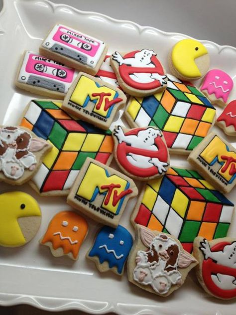 Awesome 80s cookies by SweetAmbs. PacMan, Ghostbusters, and Gremlins, oh myyy! Not to mention the Rubik's cube. 80s Candy Table, 80s Birthday Parties, 1980s Party, 90s Theme Party, 80's Party, Anniversaire Diy, 80s Theme Party, 80s Theme, 90's Birthday Party