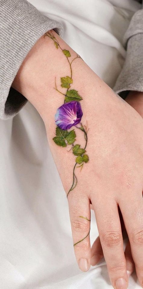 Purple Vine Tattoo, Wild Flower Hand Tattoo, Green Flowers Tattoo, Elven Leaf Tattoo, Stained Glass Flower Tattoo, Wildflower Ankle Tattoo Wrap Around, Lavender Ankle Tattoo, Colorado Columbine Tattoo, Cute Coverup Tattoos