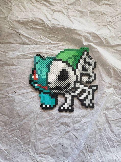 "You will receive one skeletal Bulbasaur (approx. 7\" x 6\"). This is a handmade item made from Perler beads (AKA fuse beads, hama beads) that is made to order. Will ship as soon as complete." Black And White Perler Beads, Complex Perler Bead Patterns, Perler Patterns Cute, Bulbasaur Perler Bead Pattern, Bulbasaur Perler Beads, Perler Bead Bulbasaur, Perler Bead Idea, Bulbasaur Perler, Horror Perler Beads