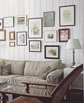 Neutral tones perfect for a beach house India Hicks Style, Salons Cottage, Striped Couch, Living Room Panelling, Striped Sofa, Beach House Living Room, India Hicks, Framed Pictures, Cottage Living Rooms