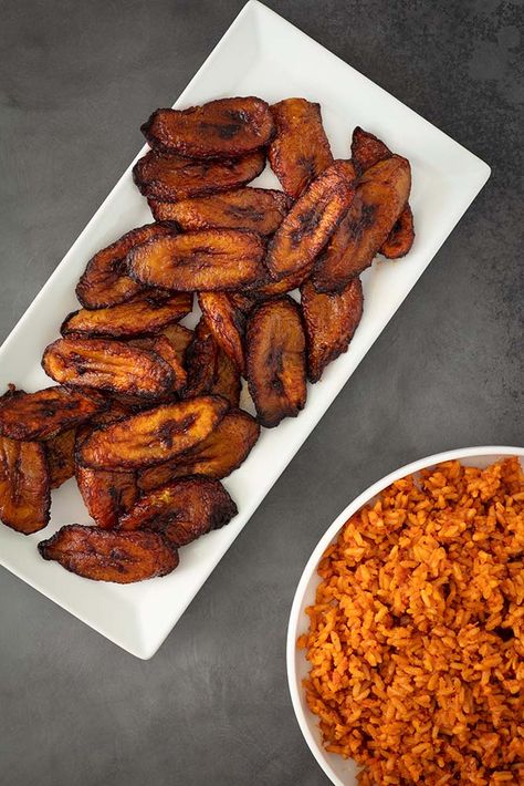 No formal gathering of Nigerian people is without this beloved staple. Those who arrive late are usually disappointed because the jollof rice and plantains are the first to disappear! Click the link for recipe Jollof Rice Nigerian With Chicken And Plantain, Jollof Rice And Plantain, Nigerian Plantain, Party Jollof Rice, Cameroonian Food, Fried Plantain, African Recipes Nigerian Food, African Dishes, Bacon Mac And Cheese