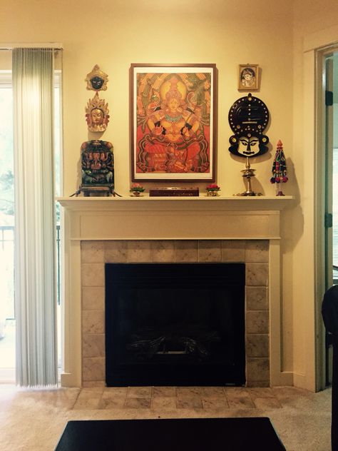 Kerala mural. Display wall sans the fireplace is what I want !! Kerala Inspired Interior, Indian Fireplace Decor, Above Fireplace Decor, Indian Living Room, India Inspired, Kerala Houses, Display Wall, Traditional Fireplace, Indian Homes