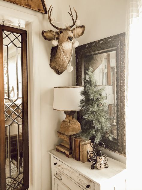 Woodland Farmhouse, Decorating With Animal Mounts, Living Room With Deer Heads, Woodland Decor Living Room, Home Decor With Deer Head, Classy Deer Mount Living Rooms, Deer Decor Living Room, Country Living Room With Deer Heads, Deer Mount Wall Arrangement