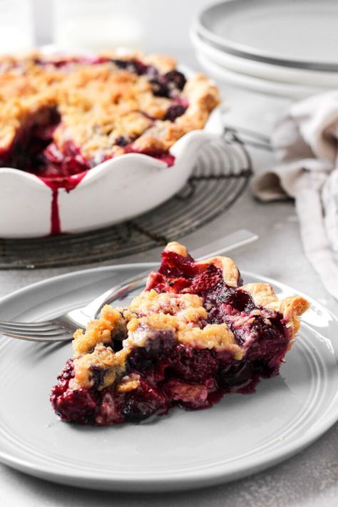 Mixed Berry Pie is made with a combination of fresh blueberries, blackberries, and strawberries that's baked into a delicious all-butter pie crust.  This pie is topped with a crumb topping for a beautiful presentation that will complement any summer gathering. #mixedberrypie #crumbtopping #thesweetoccasion Mixed Berry Pie With Crumb Topping, Mixed Berry Crumble Pie, Berry Crumble Pie, Fresh Berry Pie, Berry Pies, Crumb Topping Recipe, Mixed Berry Pie, All Butter Pie Crust, Berry Crumble