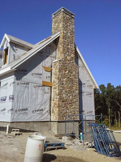 New England fieldstone chimney with granite cap stones River Rock Chimney Exterior, Stone Chimney Exterior, Exterior Chimney Ideas, Cottage Chimney, Cottage Style Exterior, Chimney Ideas, Chimney Tops, Red Brick House Exterior, Chimney Caps