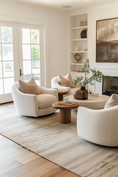 Swivel accent chairs in a neutral modern living room Easy Living Room Ideas, Modern Cottage Interior Living Room, Swivel Accent Chairs, Contemporary Living Room Chairs, Neutral Living Room Decor, Pottery Barn Living Room, Organic Living Room, Sitting Room Chairs, Modern Swivel Chair