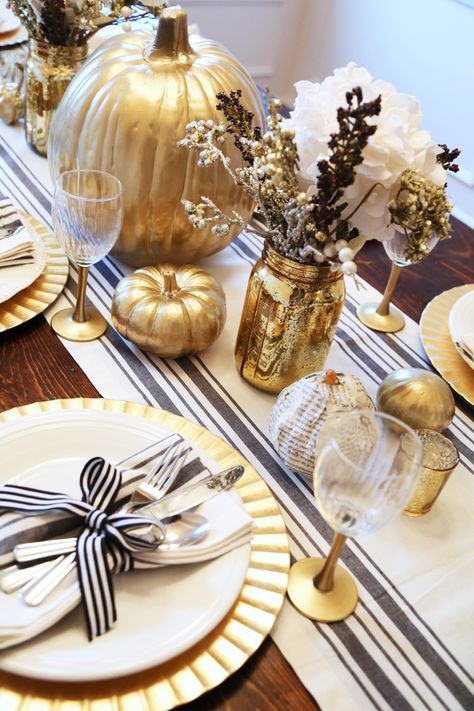 black white and gold thanksgiving table Gold And White Thanksgiving Table, Thanksgiving Table Settings Elegant Gold, White And Gold Thanksgiving Table, Black And Gold Fall Decor, Christmas Chargers, Gold Thanksgiving Table, Table Dress, Pumpkin Tablescape, Gold Pumpkin