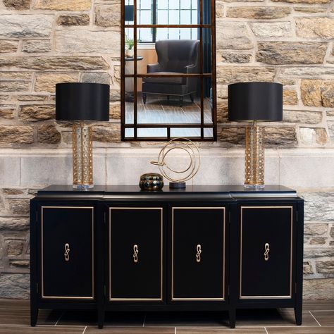 A sleek black and gold credenza with a large bronze mirror hanging over it greets guests when they step into the luxurious gathering room. The gold leaf lamps and high-style art add a luxurious look to the space. #KnoxvilleInteriorDesigner #InteriorDesign #HomeDecor #LuxuryDecor Gold Credenza, Gathering Room, Mirror Hanging, Bronze Mirror, Hanging Mirror, Luxury Decor, The Gold, Over It, Style Art