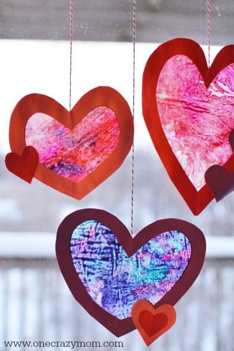 Let the kids make homemade suncatchers for the perfect Valentine's Day Craft. They will love this heart suncatcher and it's so simple to make. This Valentine’s Day craft idea is perfect for kids or adults! #onecrazymom #craftideas #valentinesdaycrafts #crafts Homemade Suncatchers, Vday Party, Heart Suncatcher, Diy Glue, Mindfulness Art, Crayon Heart, February Crafts, Easy Valentine Crafts, Valentine Craft