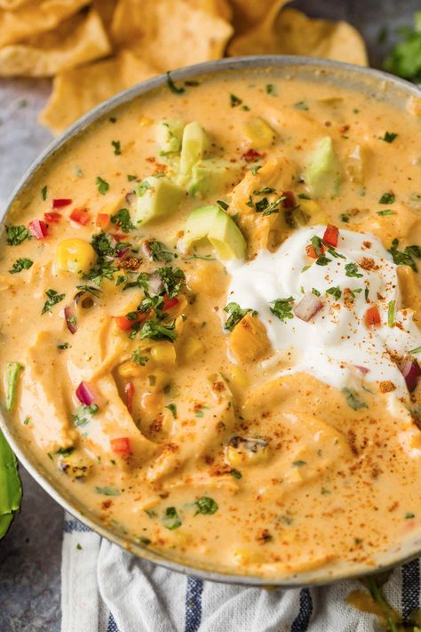 a cheesy version of everyone's favorite chicken tortilla soup! You are going to go crazy for this family favorite recipe #recipe #chicken #tortilla #soup #slowcooker Cheesy Chicken Tortilla Soup, Creamy Cheesy Chicken, Southwest Chicken Soup, Chicken Tortilla Soup Recipe, Creamy Chicken Tortilla Soup, Southwestern Chicken, Cream Of Potato Soup, Oh Sweet Basil, Chicken Tortillas Soups Recipe