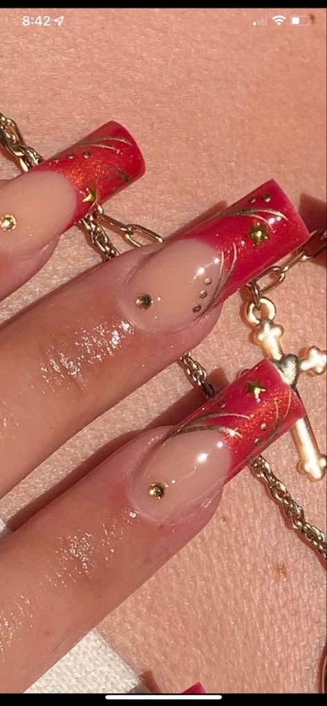 Red Gold French Nails, Red Nails Gold Charms, Gold Nail Charm Designs, Latina Nail Designs Medium, Kali Uchis Nails Ideas, Red Moon In Venus Kali Uchis Nails, Chunky Nail Charms, Ruby Nails Design, Red And Gold Chrome Nails