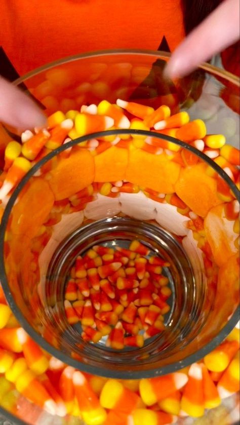 Easy DIY flower arrangement is beautiful! 😍 | Easy DIY flower arrangement is beautiful! 😍 #crafts #Halloween #flowers #DIY | By Kyle & Mistie Knight | Alright, you just lower that right inside of your big vase. So, you got a vase inside a vase. Then, we're going to take some of our candy corn. Here, It's okay. Now, I'm going to take some of these peeps. These are the Halloween peeps. These are ghosts. And you just let that fall right in there this is going to be a beautiful decoration that's p Candy Corn Flower Arrangement, Halloween Vase Filler Ideas, Large Glass Vase Filler Ideas, Diy Fall Decor Vases, Glass Vase Filler Ideas, Vase Filler Ideas, Halloween Peeps, It Pumpkin, Halloween Vase