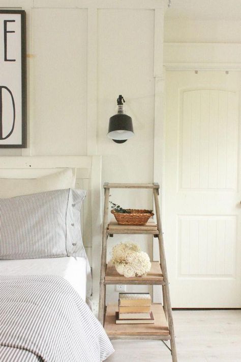 Farmhouse Master Bedroom | ladder night stand | neutral decor | farmhouse decor | swing arm lamps | ticking stripe #neutralBedroom Unique Nightstand Ideas, Rustic Farmhouse Bedroom, Unique Nightstand, Farmhouse Bedroom Decor Ideas, Farmhouse Style Bedrooms, Rustic Ladder, Decor Ikea, Прикроватные Тумбочки, Farmhouse Remodel