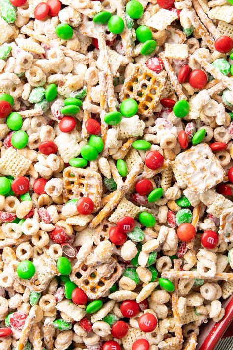 Reindeer Chow from Beaming Baker. Cheerful, festive, and colorful 5-minute Reindeer Chow has crunchy, savory pretzels, cheerios, and chex mixed together with white chocolate and red ‘n green M&M’s for the perfect salty & sweet holiday treat! Holiday Chex Mix Recipes, Chex Mix Recipes Christmas, White Chocolate Chex Mix, Chocolate Chex Mix, Christmas Snack Mix, Chex Mix Christmas, Chex Mix Recipe, Chocolate Chex, Chex Mix Recipes