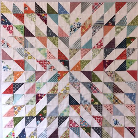 A while back, I started sewing these HST blocks together. They will finish at 4 inches. They are all Denyse Schmidt prints and white fabric from Ikea. I finished making all the HSTs, but then I had to trim all the dog ears. Finally,  I could start playing. I like this simple layout. I also… Starburst Quilt, Half Square Triangle Quilts Pattern, Triangle Quilt Pattern, Bargello Quilts, Simple Layout, Scrappy Quilt Patterns, Half Square Triangle Quilts, Dog Ears, Scrap Quilt Patterns