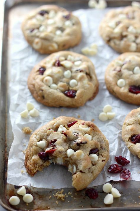 These Thick and Chewy White Chocolate Cranberry Cookies are a always a crowd-pleaser! Loaded with white chocolate chips and cranberries, they're sweet, slightly tart, and seriously delicious! Perfect for your holiday parties and Christmas cookie platters! Cranberry White Chocolate Chip Cookies Hello, Day 5 of Christmas in July!!! Today's new recipe is actually an old White Chocolate Cranberry Bliss Bars, White Chocolate Chip Cookies With Dried Cranberries, Farkleberry Cookie Recipe, Christmas White Chocolate Cranberry Cookies, Cranberry White Chocolate Chip Macadamia Cookies, Oatmeal Cranberry White Chocolate Walnut Cookies, White Chip Cranberry Cookies, Orange Cranberry White Chocolate Cookies, White Chocolate Chip And Cranberry Cookies