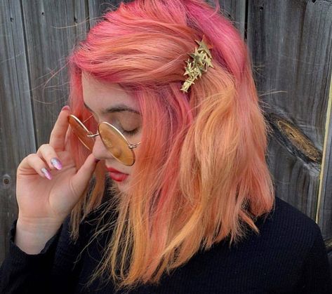 Arctic Fox hair color. When beauty stops you in your tracks, you know it's for you! 💃 This fox created this gorgeous color melt using Virgin Pink, Neon Moon, and diluted Sunset Orange! 💓🧡 Oh, and you can't forget to add your favorite hair clip too! 🤩 (IG: sweethairafter) Pink And Orange Peekaboo Hair, Pink Orange Blonde Hair, Pastel Pink And Orange Hair, Pinky Orange Hair, Pink Orange Hair Color, Sunset Orange Arctic Fox Hair, Creamsicle Hair, Sunset Orange Hair, Orange And Pink Hair