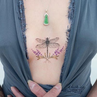 Lavender Dragonfly Tattoo, Dragonfly Tattoo Design Color, Dragonfly Underboob Tattoo, Lavender Sternum Tattoo, Colored Dragonfly Tattoo, Dragonfly Tattoo Chest, Dragonfly Chest Tattoo, Chiari Tattoo, Dragonfly Tattoo Color