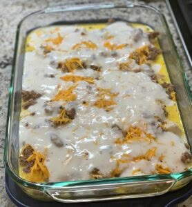 Biscuits and Gravy Breakfast Casserole - The Cookin Chicks Tator Tot Sausage Gravy Casserole, Morning Biscuits, Biscuits And Gravy Breakfast Casserole, Gorilla Bread, Sausage And Egg Breakfast Casserole, Biscuits And Gravy Breakfast, Gravy Breakfast Casserole, Gravy Breakfast, Sausage And Egg Breakfast