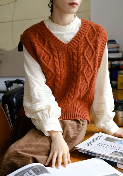 Oversized v-neck sweater vest with classic cable knitted details in a cozy red-orange color. Do note that the color may appear more red or orange depending on the lighting and camera capabilities. S: 17" shoulders, 39" chest, 19.5" lengthM: 17.5" shoulders, 40.5" chest, 20" length Red Knitted Vest Outfit, Cable Knit Vest Pattern, Womens Sweater Vest Outfit, Red Sweater Vest Outfit, Orange Vest Outfit, Red Vest Outfit, Turtleneck Outfit Layering, Knitted Vest Outfit, Style Sweater Vest