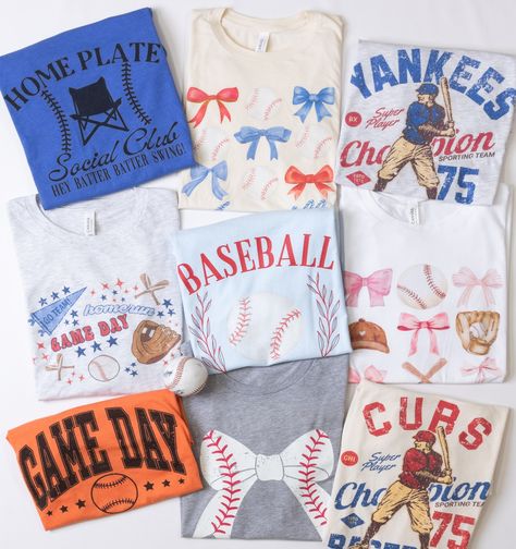 From the bleachers to the dugout, show off your baseball mom pride with our trendy and super cute but comfy graphic tees. Perfect for those endless days at the ballpark—because being a baseball mom is a full-time job, and you deserve to look fabulous doing it! #BaseballMoms #BallParkStyle #TrendyTees #SportyChic #LimeberryDesigns #FashionHomeRun #MVPofFashion #GameDayGoals #MomLife #TeamMom #BleacherFashion Trendy Crew Neck T-shirt For Baseball Season, Sporty T-shirt For Baseball Season Game Day, Sporty T-shirt For Baseball Season, Cotton T-shirt For Game Day During Baseball Season, Cotton T-shirt For Baseball Game Day, Hey Batter Batter, The Bleachers, Mom Pride, Team Mom